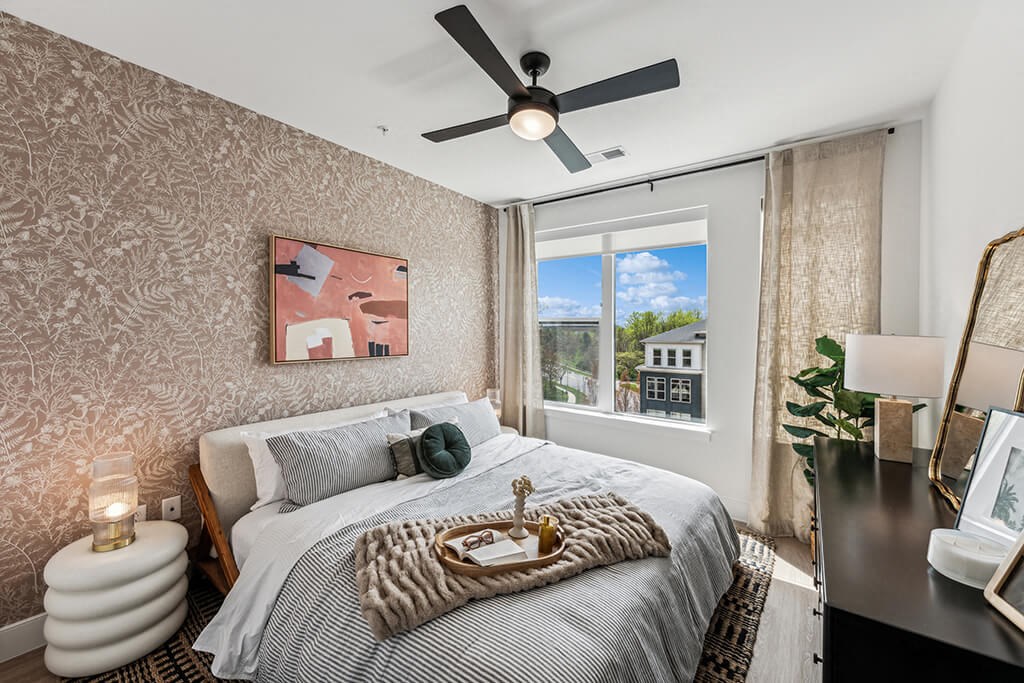 Bedroom with accent wall at 333 Ellington Apartments in Gaithersburg MD