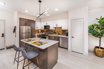 Model Bronze Finish Package Kitchen at Aura Apartment Homes in Orange CA