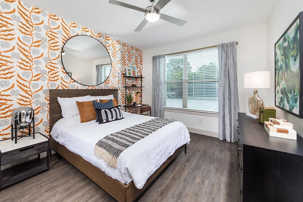 Bedroom with ceiling fan at 1900 Parmer Apartments in Austin TX
