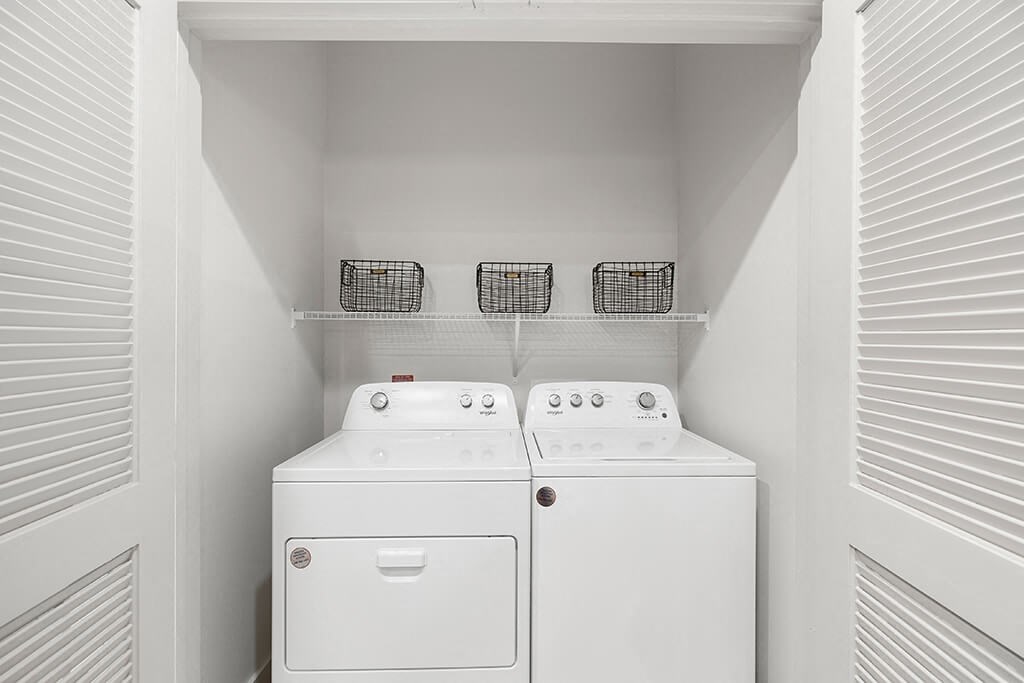 Model Concrete Design Package Washer and Dryer at East Bend Apartments in Houston TX