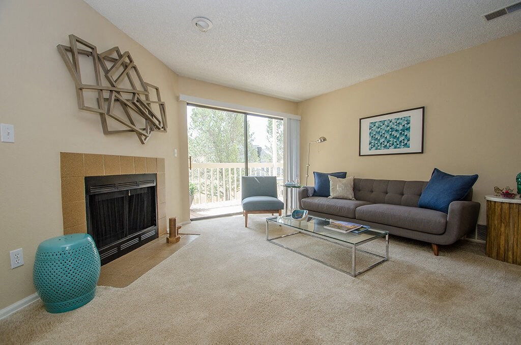 Model Living Room Fireplace at Rock Peak on Sunset Apartments in Longmont CO