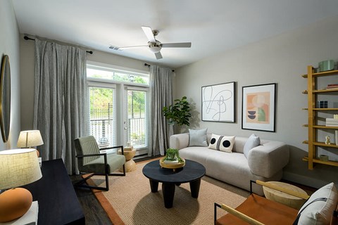 Living room with ceiling fan at Verge Apartments in Atlanta, GA
