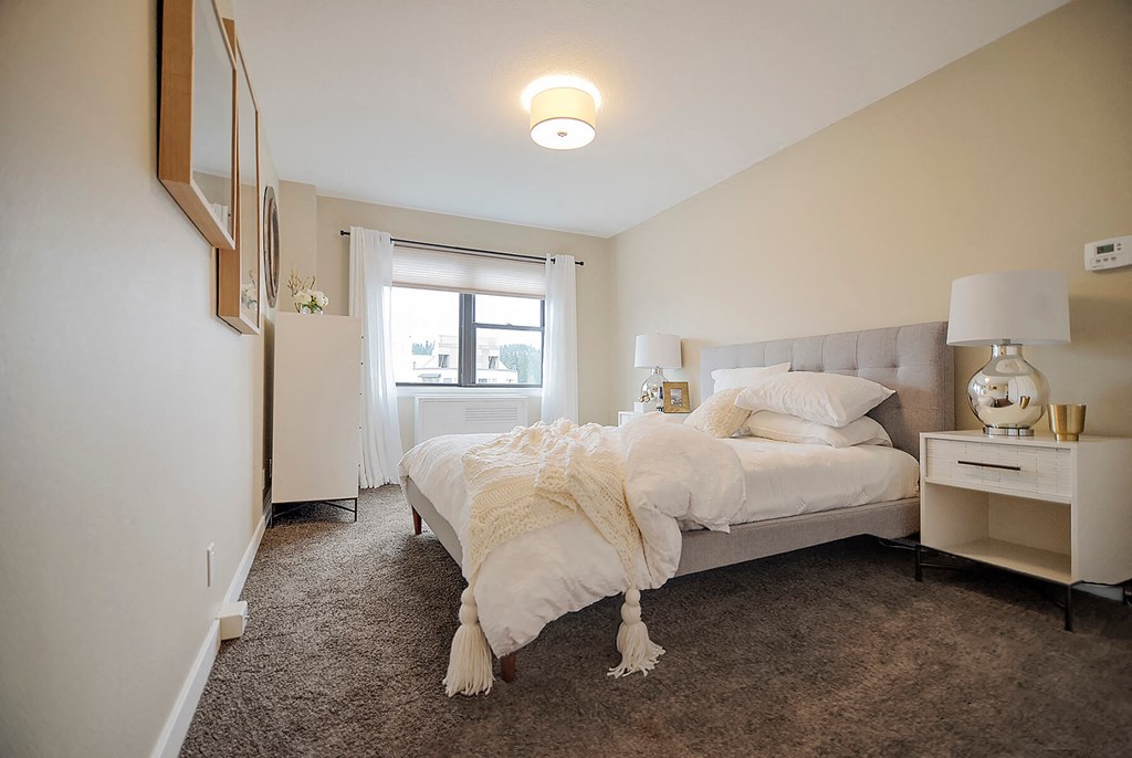 Model Main Bedroom at 735 St Clair Apartments in Portland OR