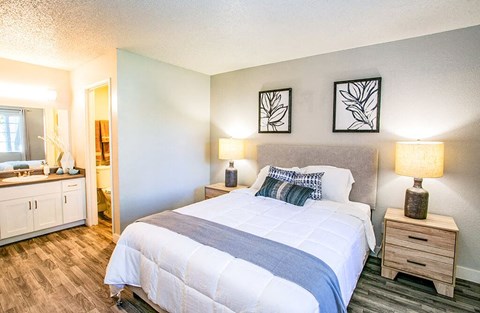 a bedroom with a bed and a bathroom