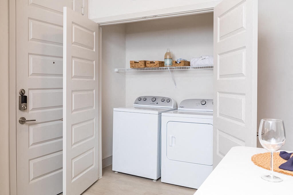 a white washer and dryer in a laundry room