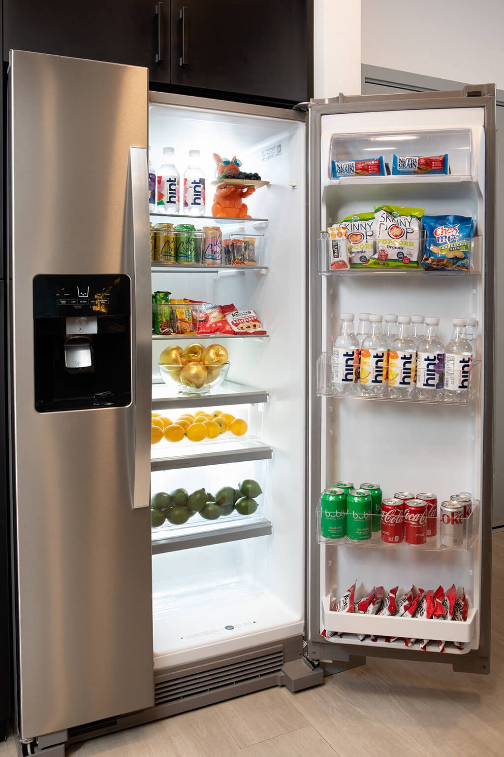 Model Pewter Kitchen Fridge Open at Chroma Apartment Homes in Canoga Park CA