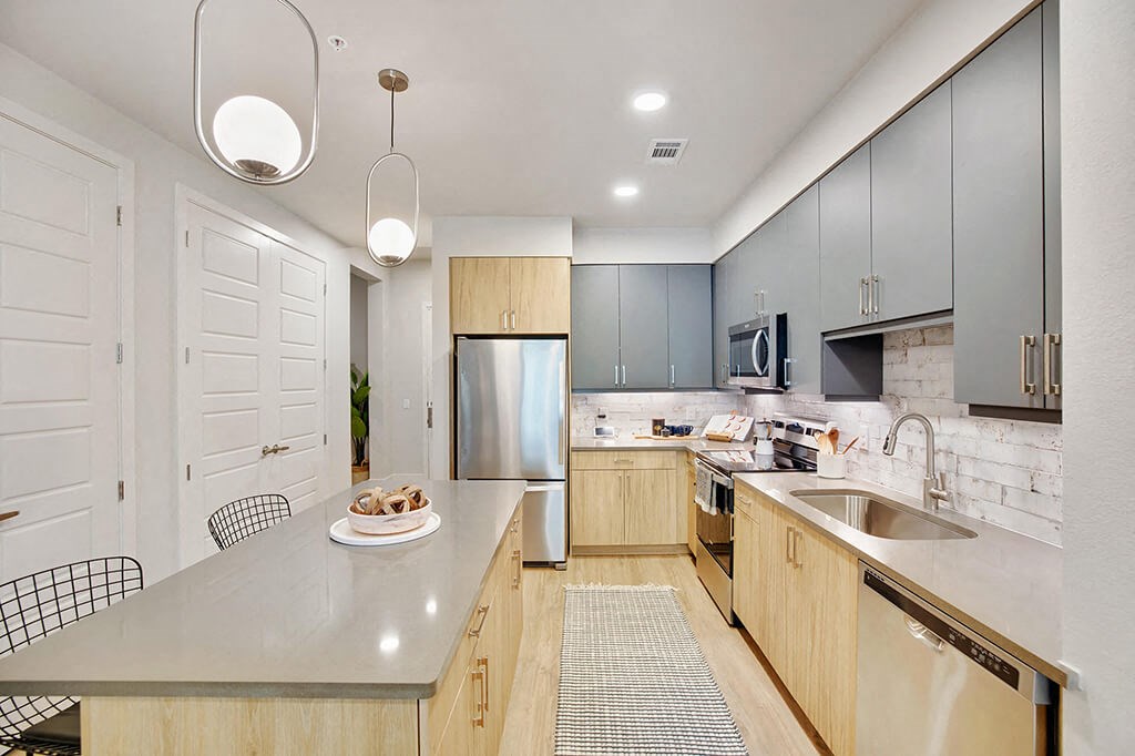 Model Sandalwood Design Package Kitchen at 1810 Main Apartments in Houston TX