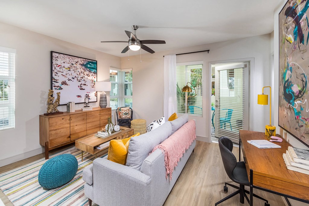 Sepia Design Package Living Room with ceiling fan at The Seaton Apartments in San Diego CA