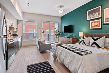 Bedroom with window view at Radiate Apartments in Redmond WA - Photo Gallery 4