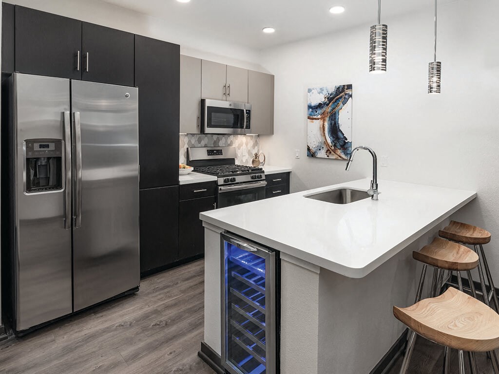 Model ktichen with island seating at Norte Town Lake Apartments in Tempe Arizona