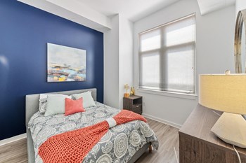 Bedroom with hardwood flooring at Bradley Braddock Road Station Apartments in Alexandria VA - Photo Gallery 8
