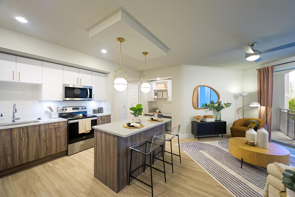 Model kitchen and living area at Coasterra Apartments in Fort Lauderdale FL