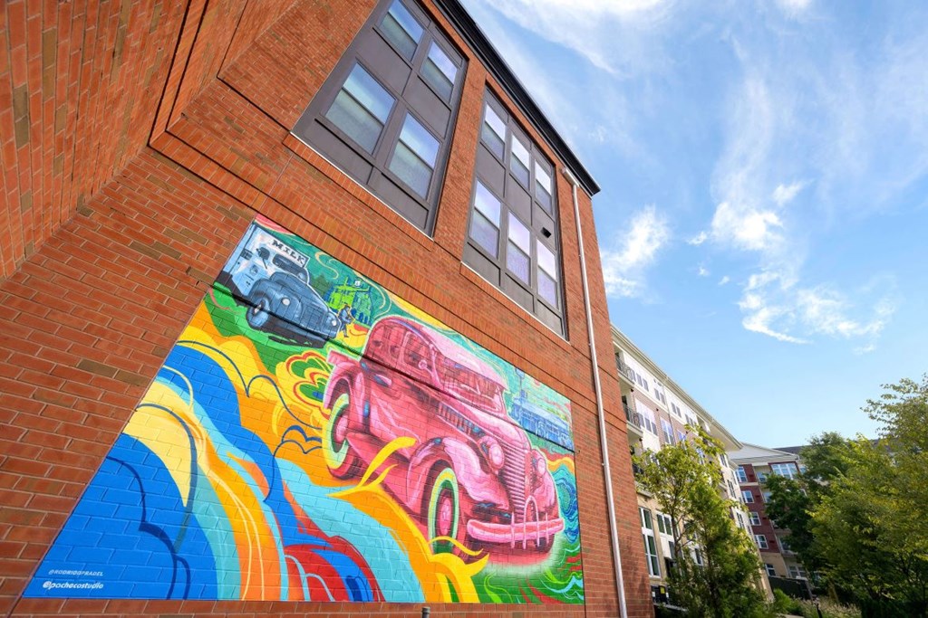 A mural of a car on the side of a building