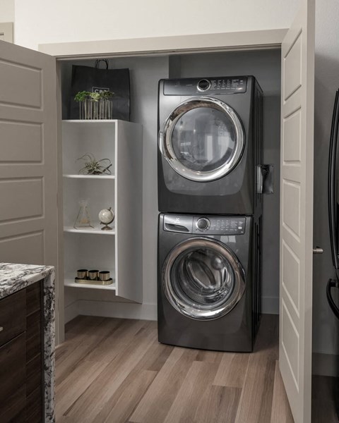 Stacked washer and dryer in unit at District at Scottsdale Apartments in Scottsdale AZ