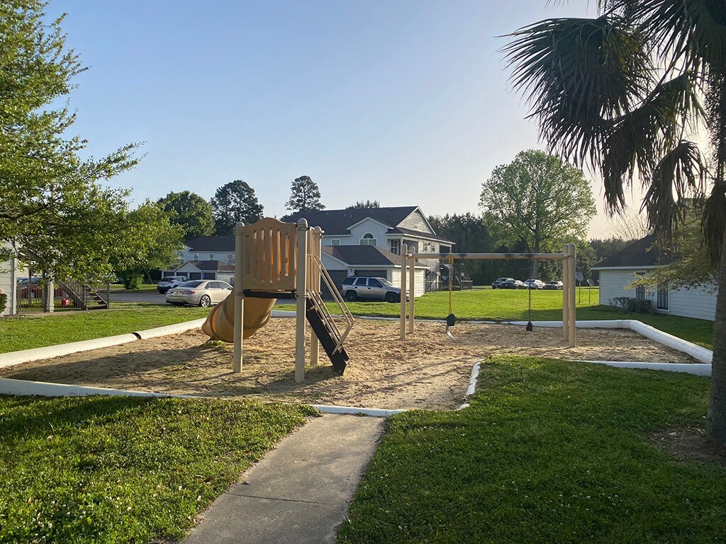 Playground outside at Dayton Park Apartments in Dayton TX