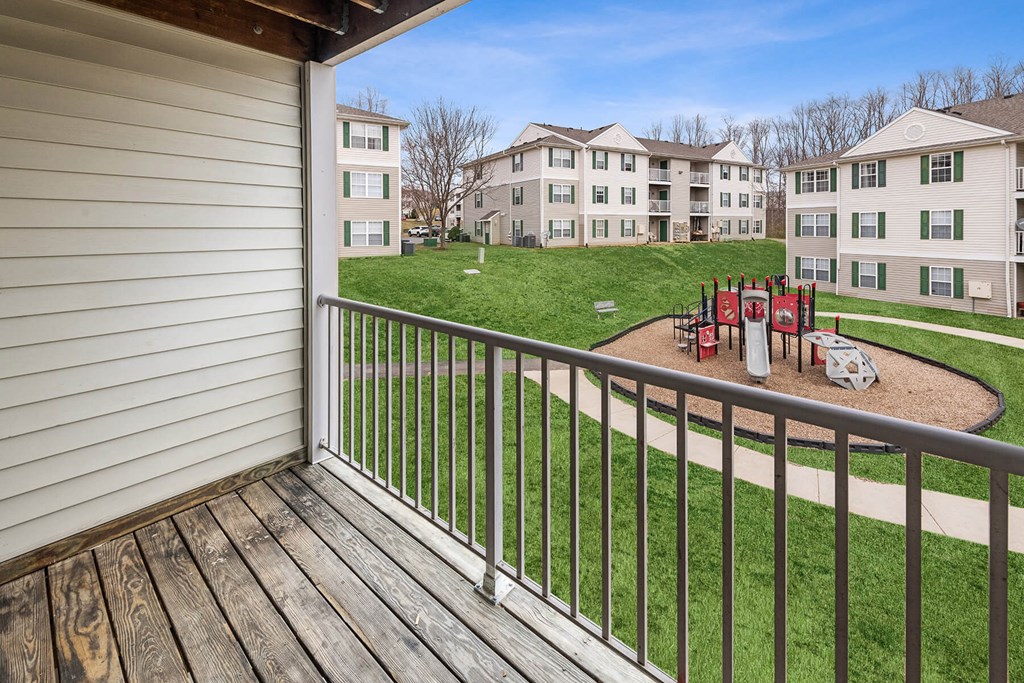 Apartments for Rent in Fredericksburg - England Run North - Playground with Climb Equipment and Slide Surrounded by Grass