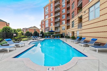 Outdoor swimming pool at Bradley Braddock Road Station Apartments in Alexandria VA - Photo Gallery 10