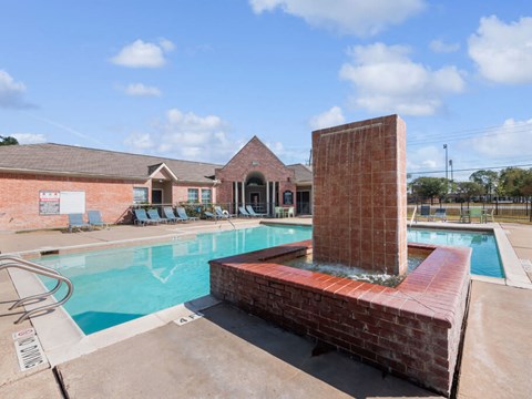 Pool with water feature at Forest Creek Apartments in Houston TX