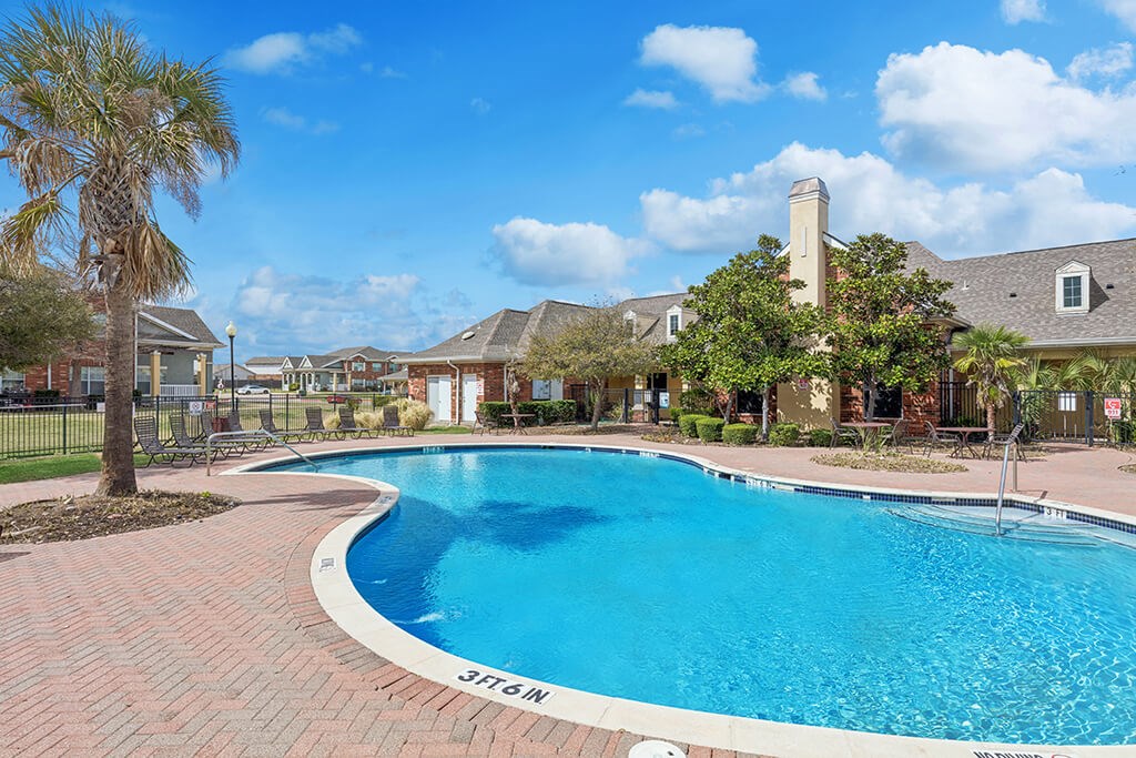 Swimming pool sun deck at Ironwood Crossing Apartments and Townhomes in Fort Worth TX
