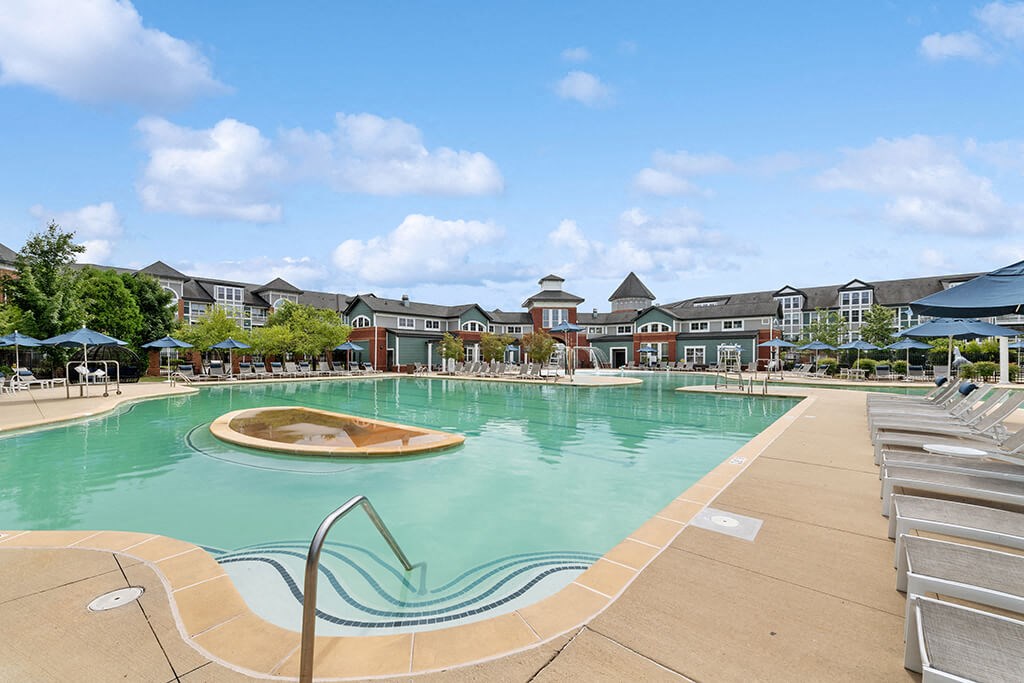 the swimming pool at the resort at governors crossing apartments
