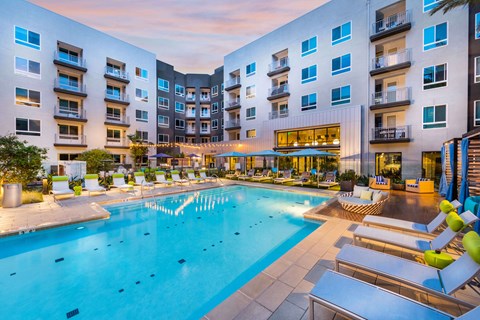 Swimming pool at dusk at Avel Apartment Homes in Orange CA