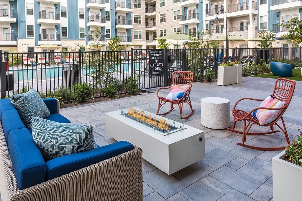 Pool deck fire table at 1900 Parmer Apartments in Austin TX