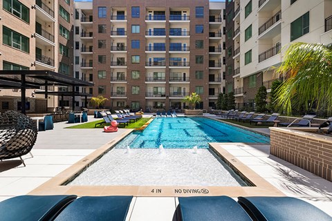 Pool Lounge Chairs at 1810 Main Apartments in Houston TX