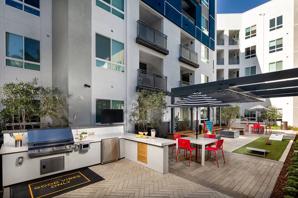 Pool Luminescence Grill and Fite Table On at Chroma Apartment Homes in Canoga Park CA