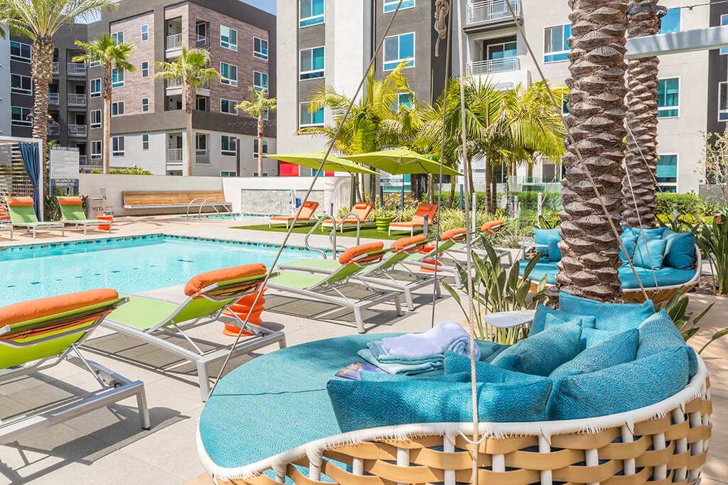 Pool Vibe Swings and Lounge Chairs Angled at Vita Apartment Homes in Orange CA