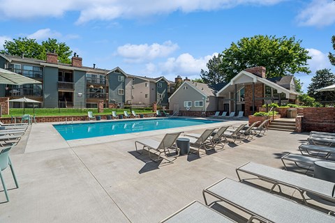Pool and loungers at Rock Peak on Sunset Apartments in Longmont CO