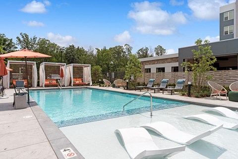Pool and tanning shelf at The Quill Apartments in Milford MA