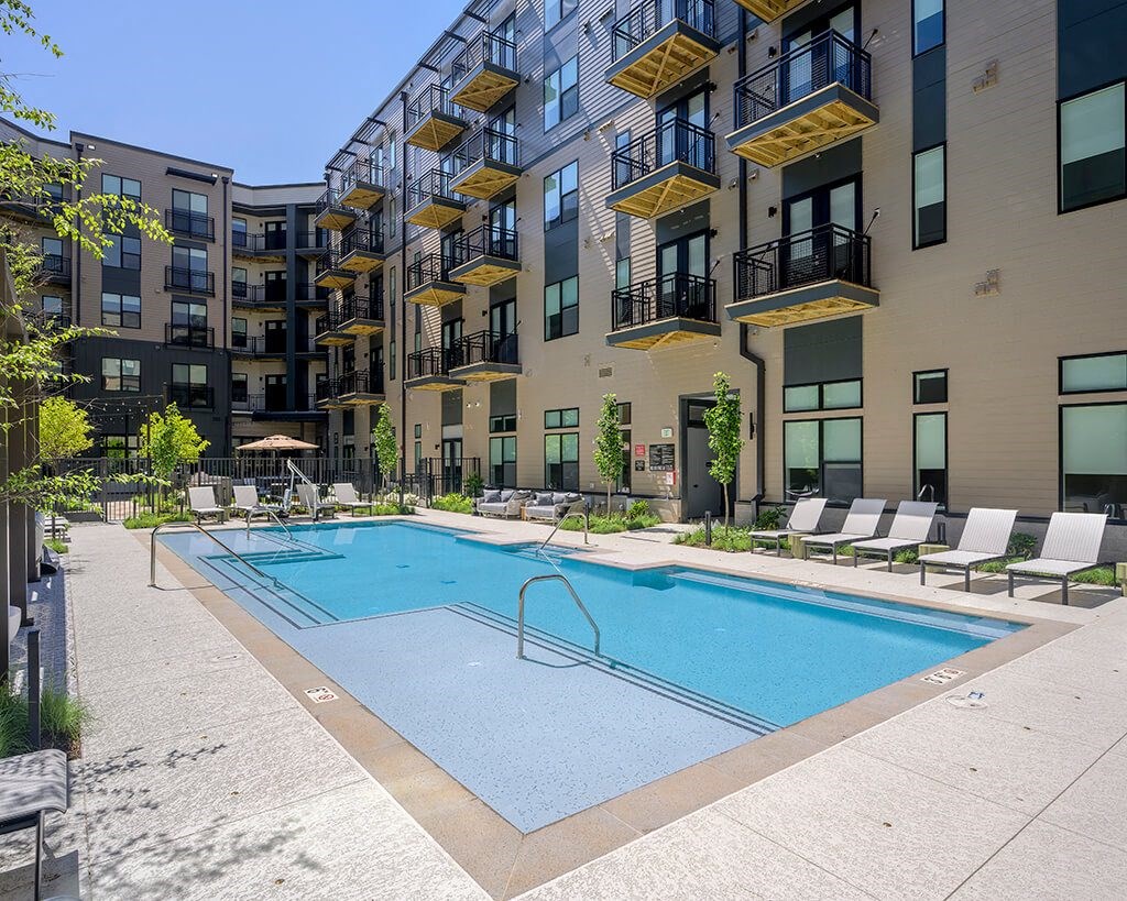 Pool with chairs at 333 Ellington Apartments in Gaithersburg MD