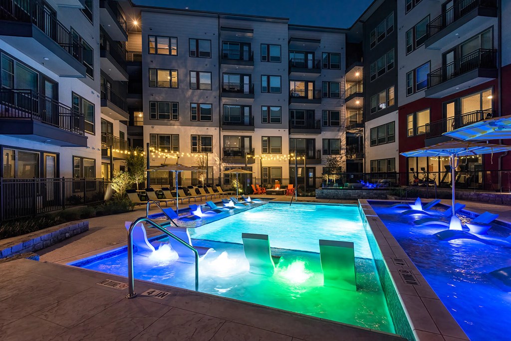Night time pool view at Opal Legacy Central in Plano TX