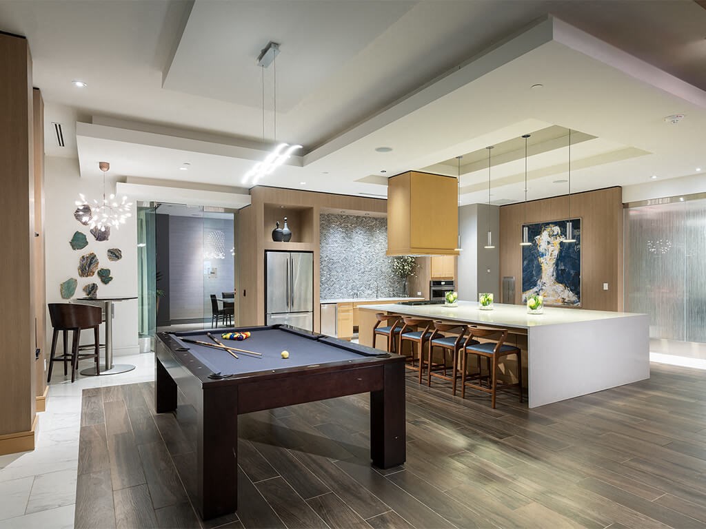 Pool table and demo kitchen at Cirro King of Prussia Apartments in King of Prussia PA