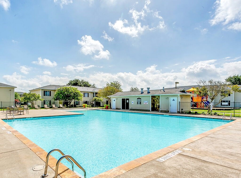 Pool with sun deck at Paradise Oaks apartments in Austin TX