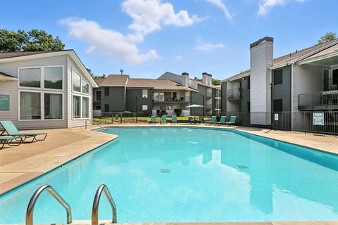 Pool with lounge chairs at Newport Apartment Homes in Nashville TN