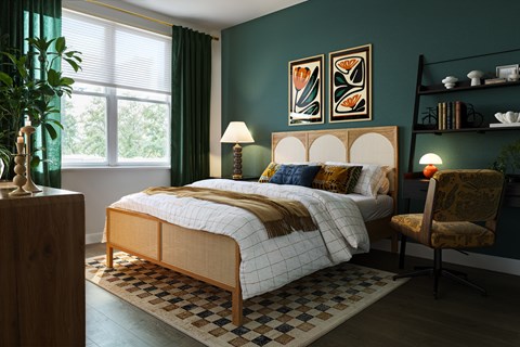 A bedroom with a bed, chair, and lamp.