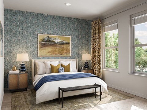 A bedroom with a large bed and a painting of a beach scene on the wall.