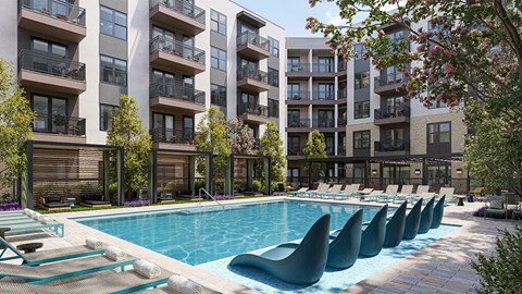 Outdoor pool and chairs at Merrick on Midway Apartments in Farmers Branch TX