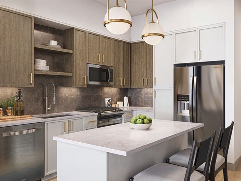 A modern kitchen with a stainless steel refrigerator and a marble countertop.
