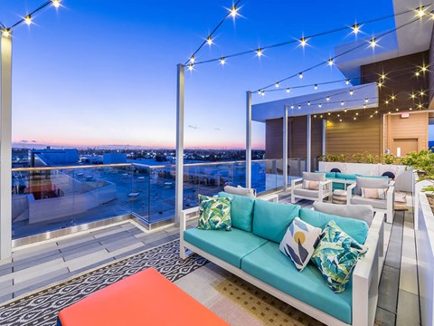 Rooftop Deck Seating at Dusk at Embark Apartments in Fremont CA
