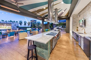 Rooftop Lounge Uplift Lanai at Dusk at Aura Apartment Homes in Orange CA - Photo Gallery 11