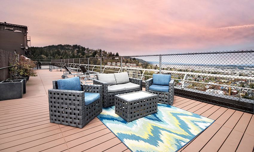Rooftop Seating Area at Dusk at 735 St Clair Apartments in Portland OR - Photo Gallery 1