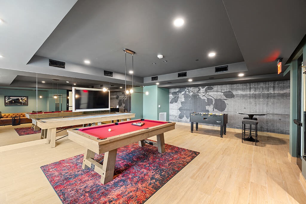 Social lounge gaming area at East Bend Apartments in Houston TX