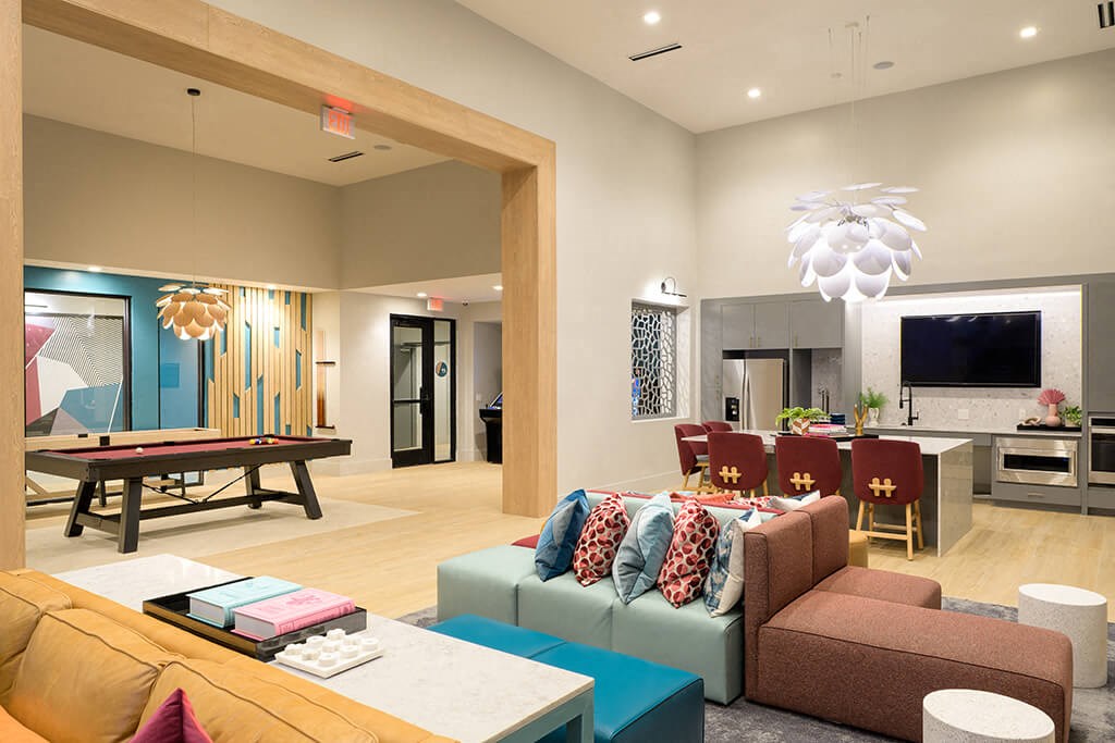 a living room and dining room with a pool table