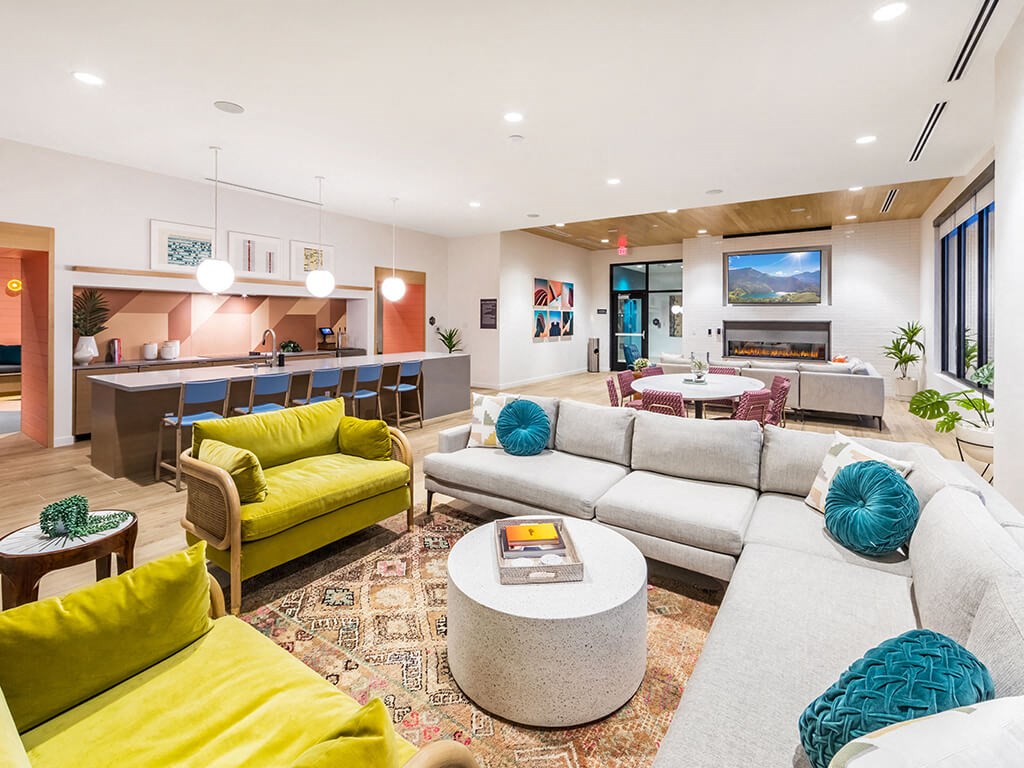 Social Lounge Seating and Kitchen at Embark Apartments in Fremont CA