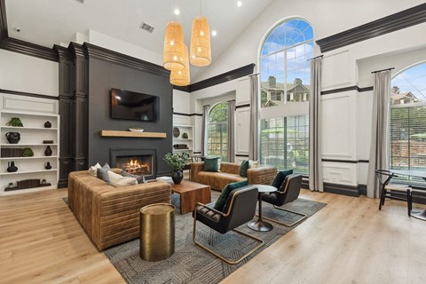 the living room has a fireplace and a large window