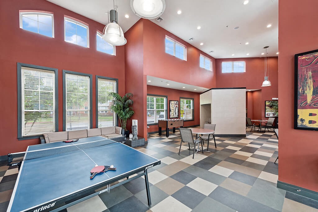 a game room with a ping pong table