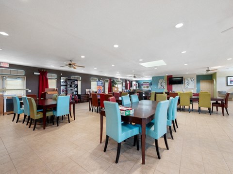 a dining room with tables and chairs in a restaurant