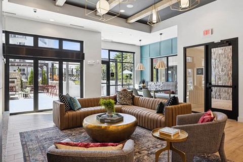 a living room with couches and chairs and a table